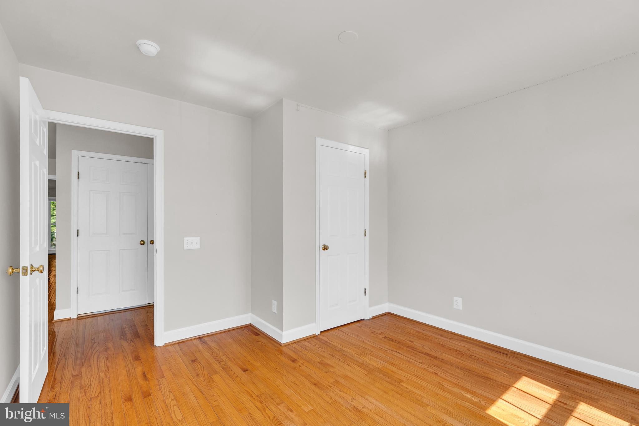 9249 Laurel Ridge Crossing Road Lorton, VA 22079 - Photo 15 of 38 a view of an empty room and wooden floor