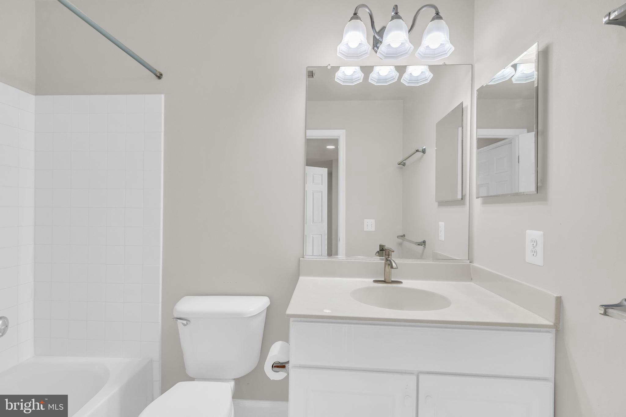 9249 Laurel Ridge Crossing Road Lorton, VA 22079 - Photo 16 of 38 a bathroom with a sink and a mirror