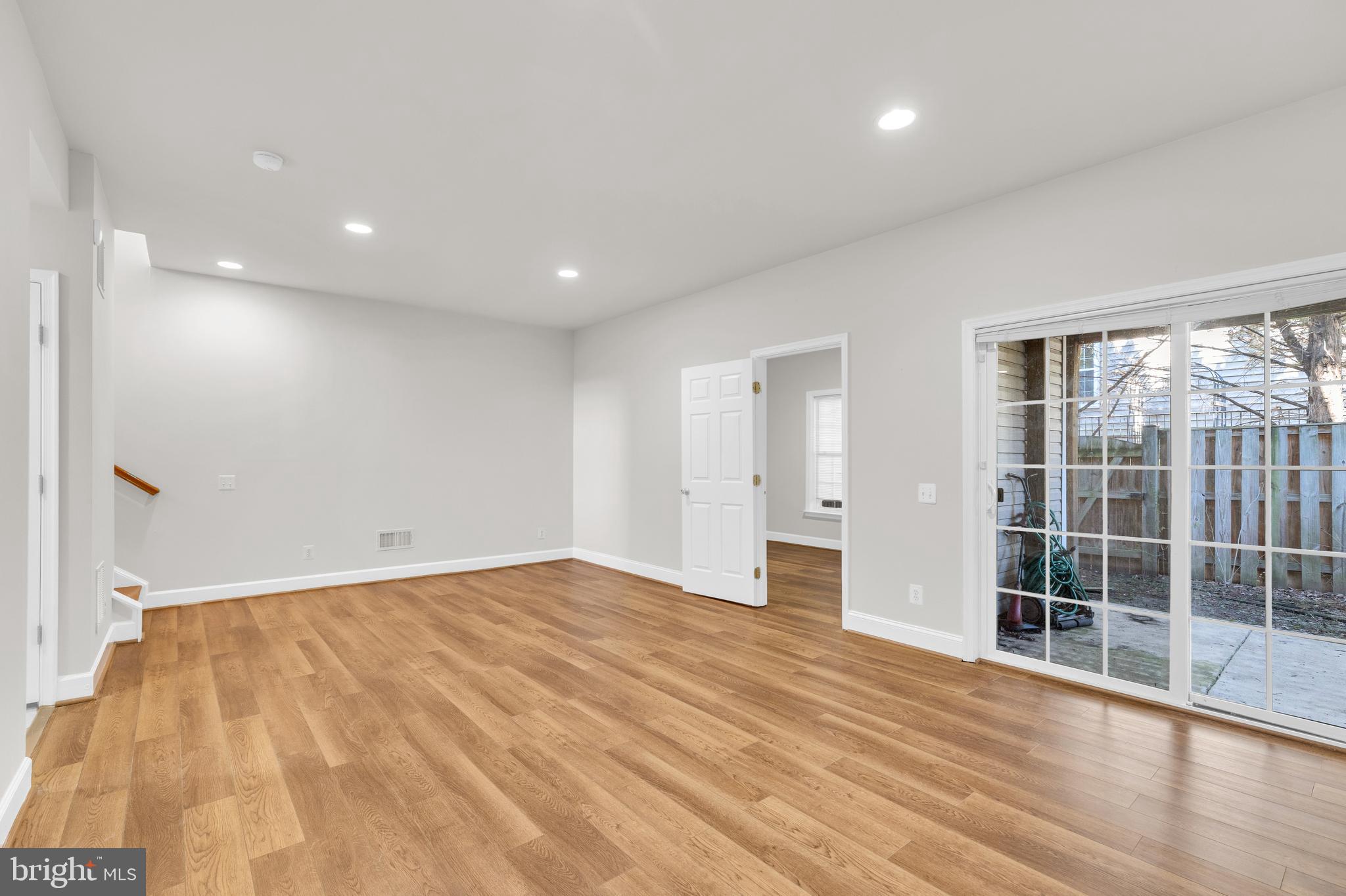 9249 Laurel Ridge Crossing Road Lorton, VA 22079 - Photo 19 of 38 a view of empty room with wooden floor and fan