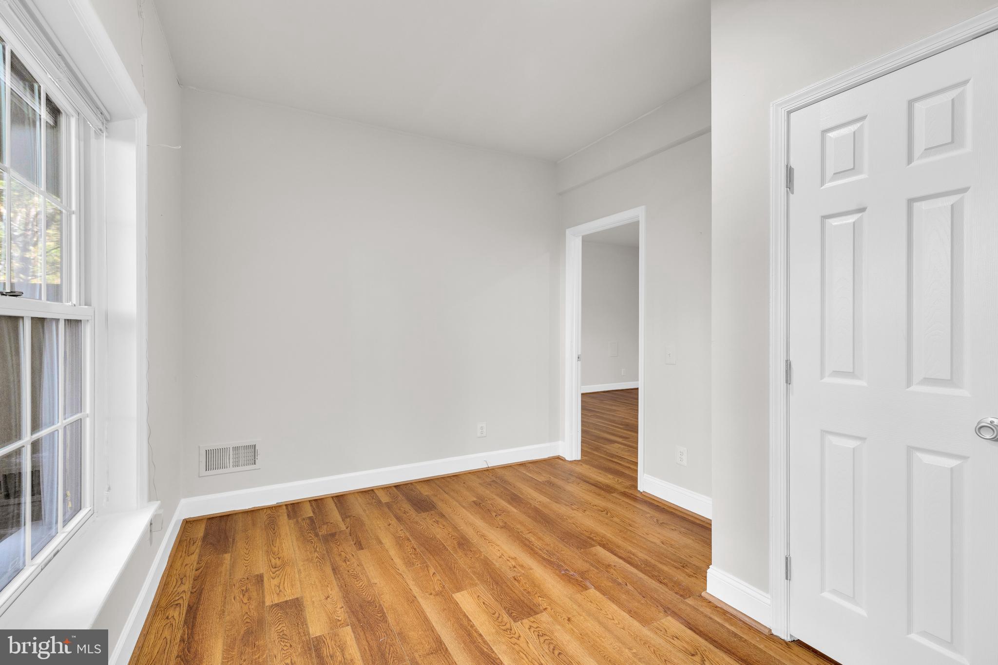 9249 Laurel Ridge Crossing Road Lorton, VA 22079 - Photo 20 of 38 an empty room with wooden floor and windows