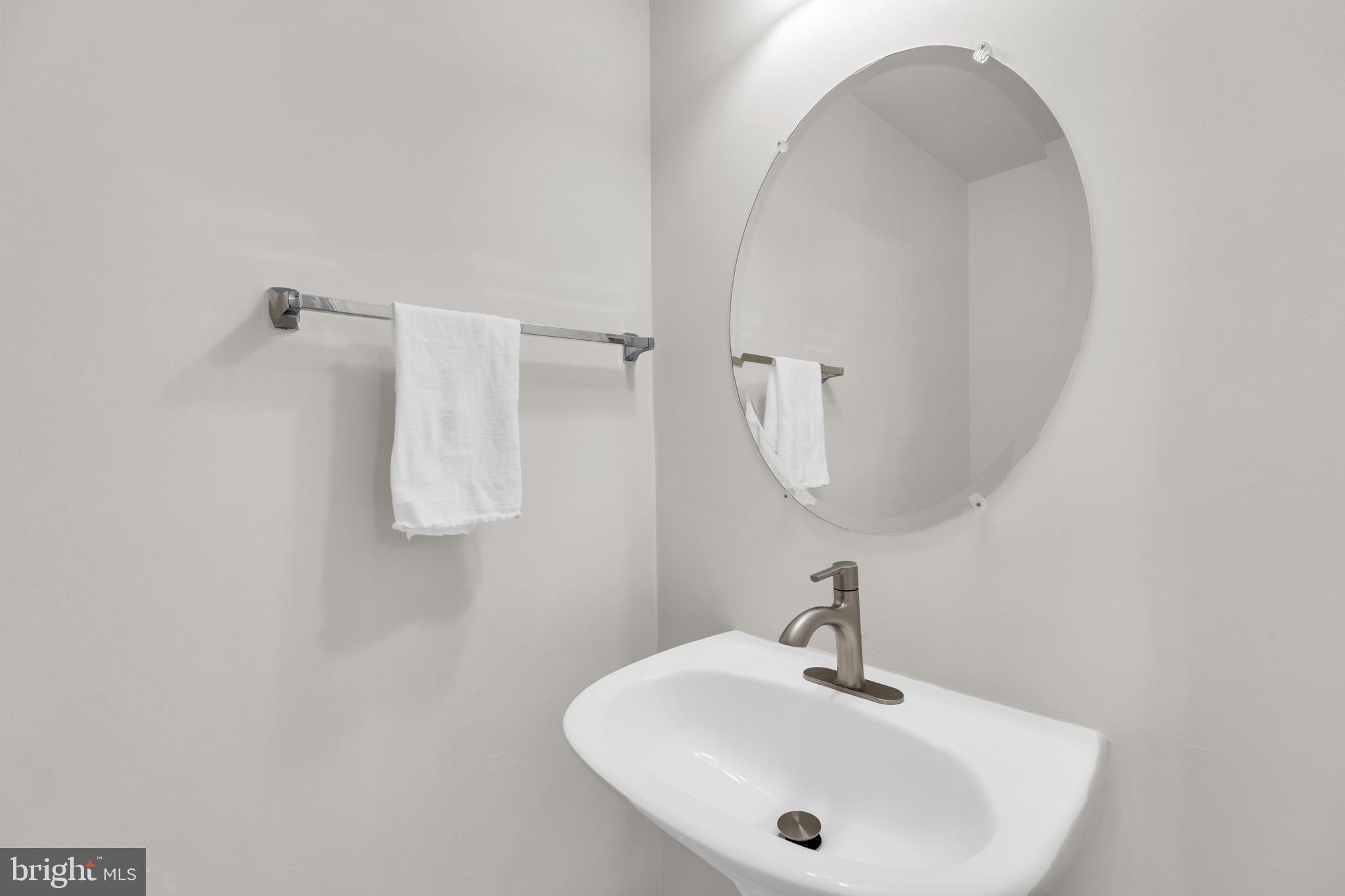 9249 Laurel Ridge Crossing Road Lorton, VA 22079 - Photo 24 of 38 a bathroom with a sink and a mirror