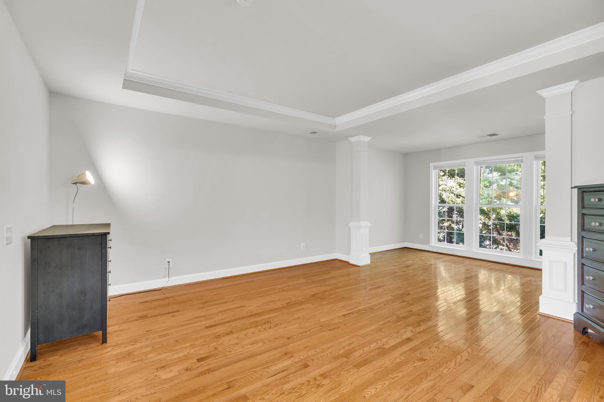 9249 Laurel Ridge Crossing Road Lorton, VA 22079 - Photo 25 of 38 a view of an empty room with wooden floor and a window