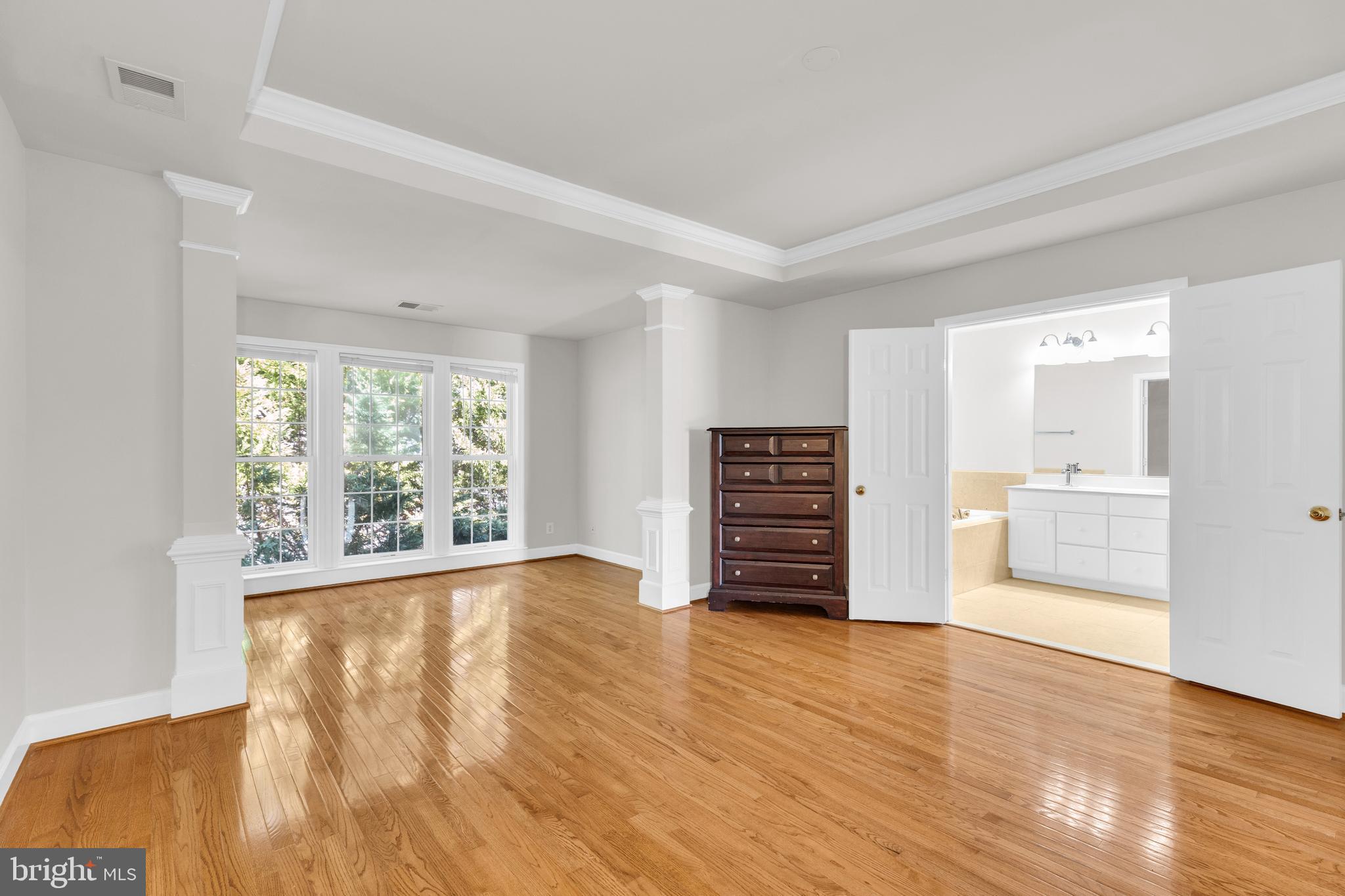 9249 Laurel Ridge Crossing Road Lorton, VA 22079 - Photo 26 of 38 a view of an empty room with a window and wooden floor