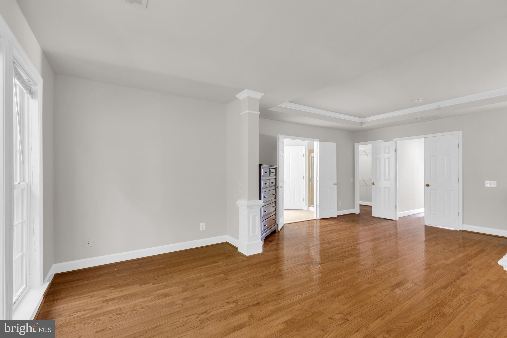 9249 Laurel Ridge Crossing Road Lorton, VA 22079 - Photo 28 of 38 a view of an empty room with wooden floor and a window