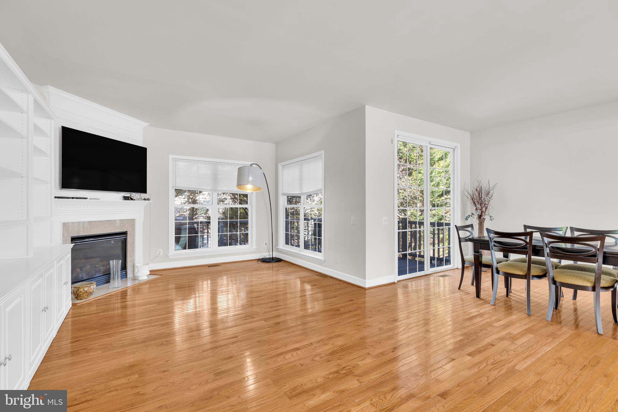 9249 Laurel Ridge Crossing Road Lorton, VA 22079 - Photo 34 of 38 a living room with furniture a fireplace and a flat screen tv