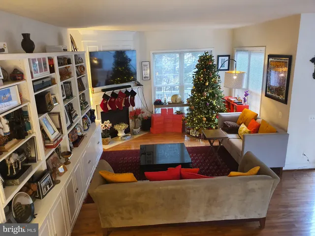 a living room with lots of furniture and a flat screen tv