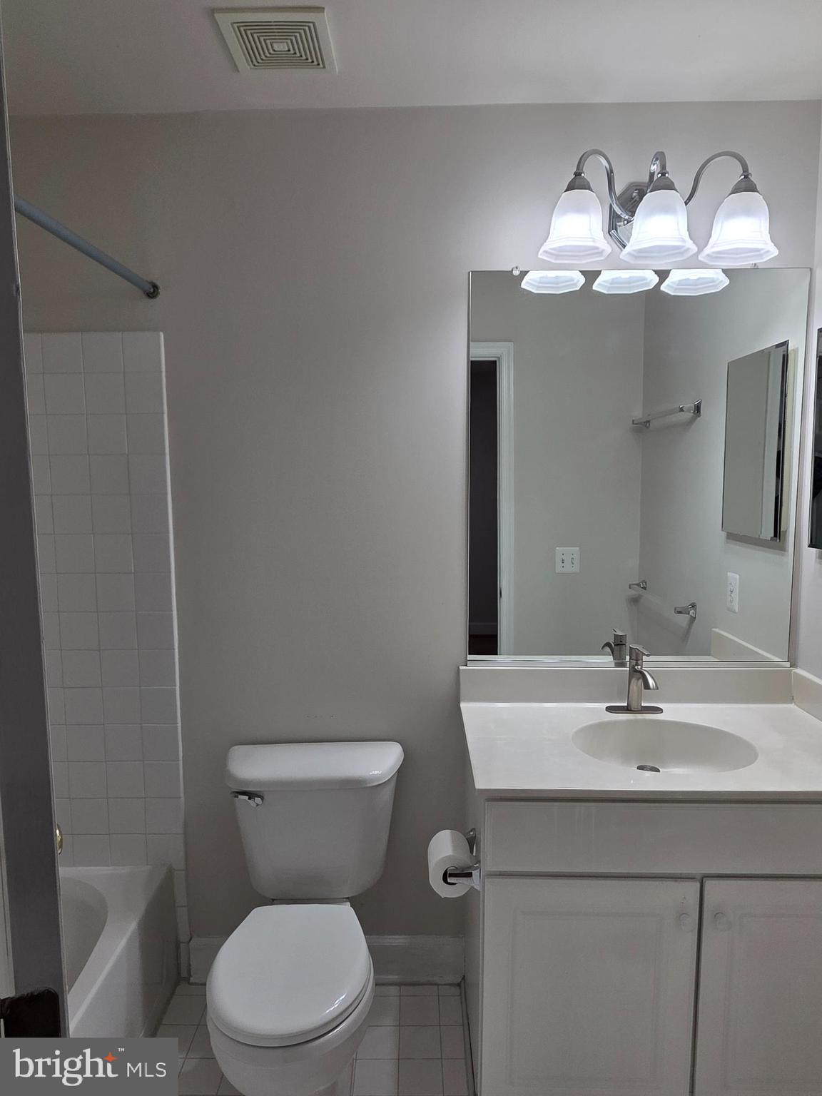 9249 Laurel Ridge Crossing Road Lorton, VA 22079 - Photo 9 of 38 a bathroom with a sink a toilet and a mirror