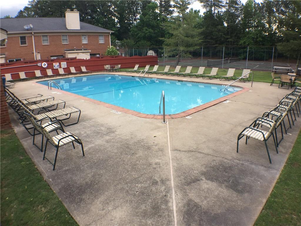 2906 Webb Bridge Road Alpharetta, GA 30009 - Photo 23 of 27 a view of a swimming pool with lounge chairs