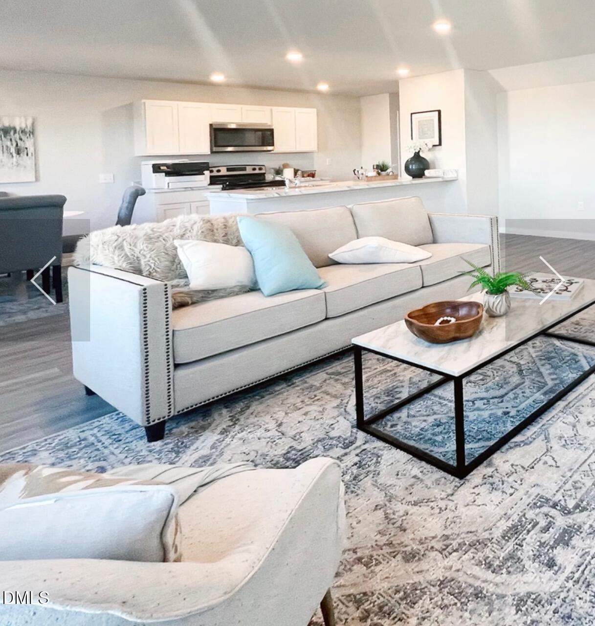 76 Landon Place Roxboro, NC 27573 - Photo 2 of 6 a living room with furniture and kitchen view
