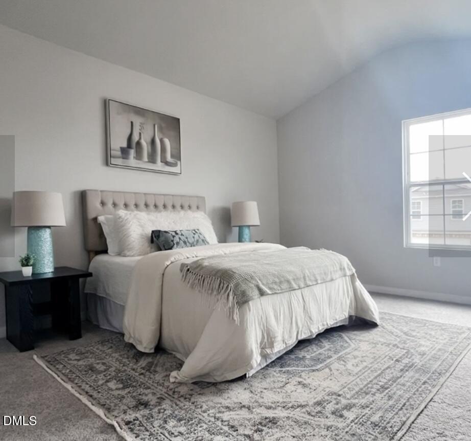 76 Landon Place Roxboro, NC 27573 - Photo 3 of 6 a bedroom with a bed and painting on the wall