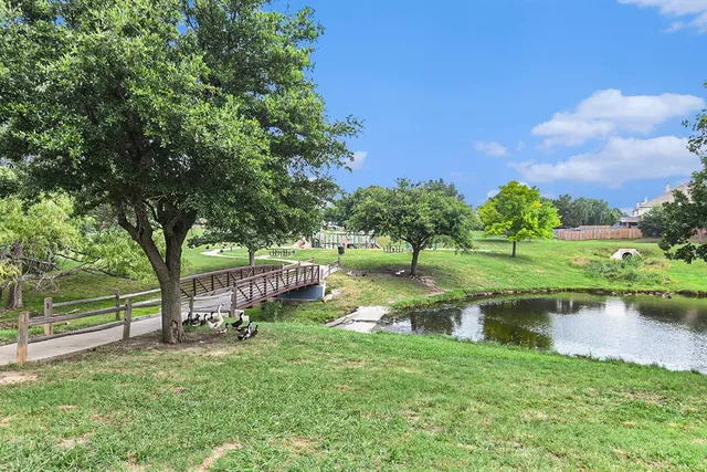 a view of a lake with a building in the background