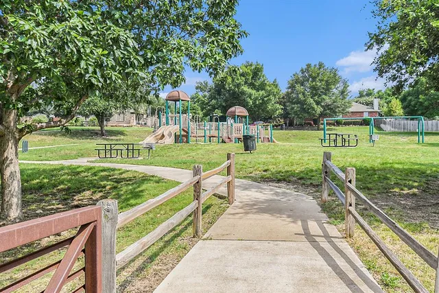 a view of a park with large trees