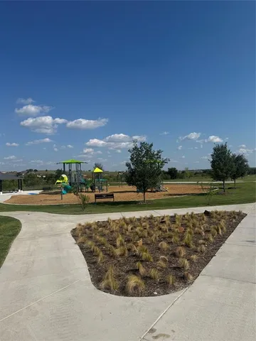 a view of a swimming pool and an outdoor seating