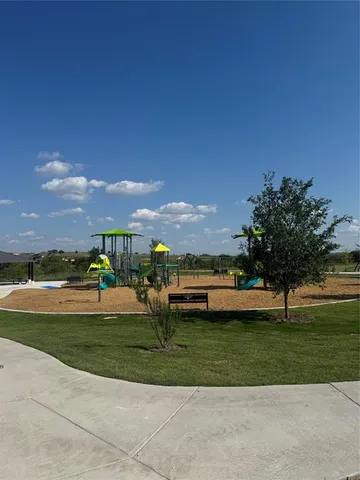 a view of a golf course with a lake view