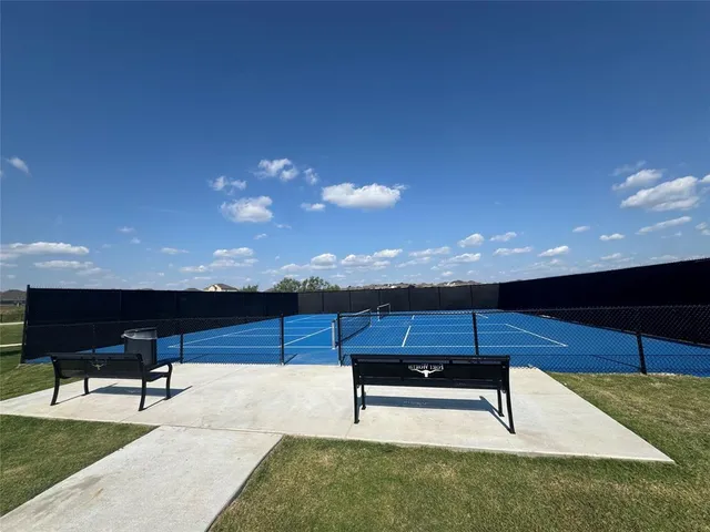 a view of a backyard with sitting area