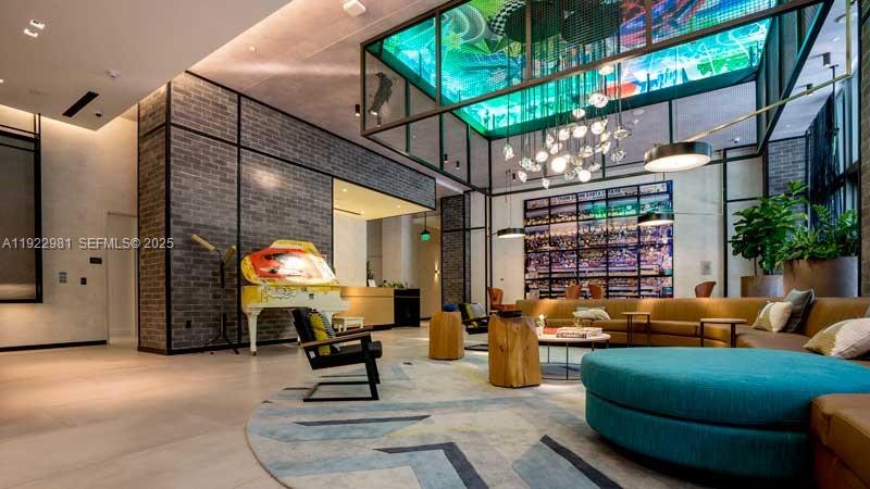 121 Northeast 34th Street, Unit 2701 Miami, FL 33137 - Photo 36 of 43 a view of a patio with a table and chairs