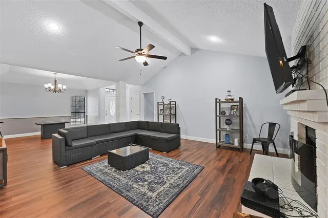 a living room with furniture and a rug