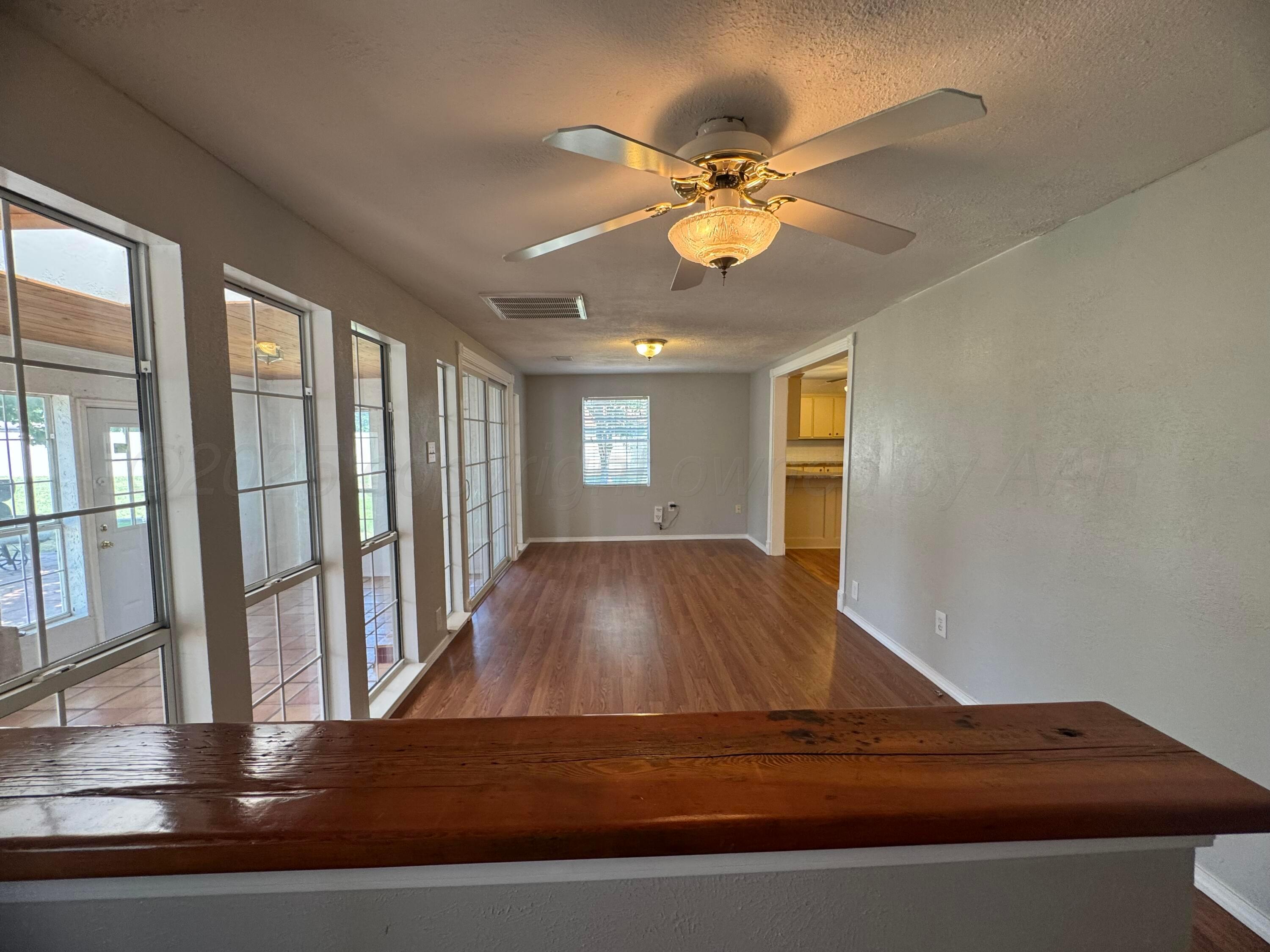 5112 Arden Road Amarillo, TX 79110 - Photo 12 of 28 a view of room with window and ceiling fan