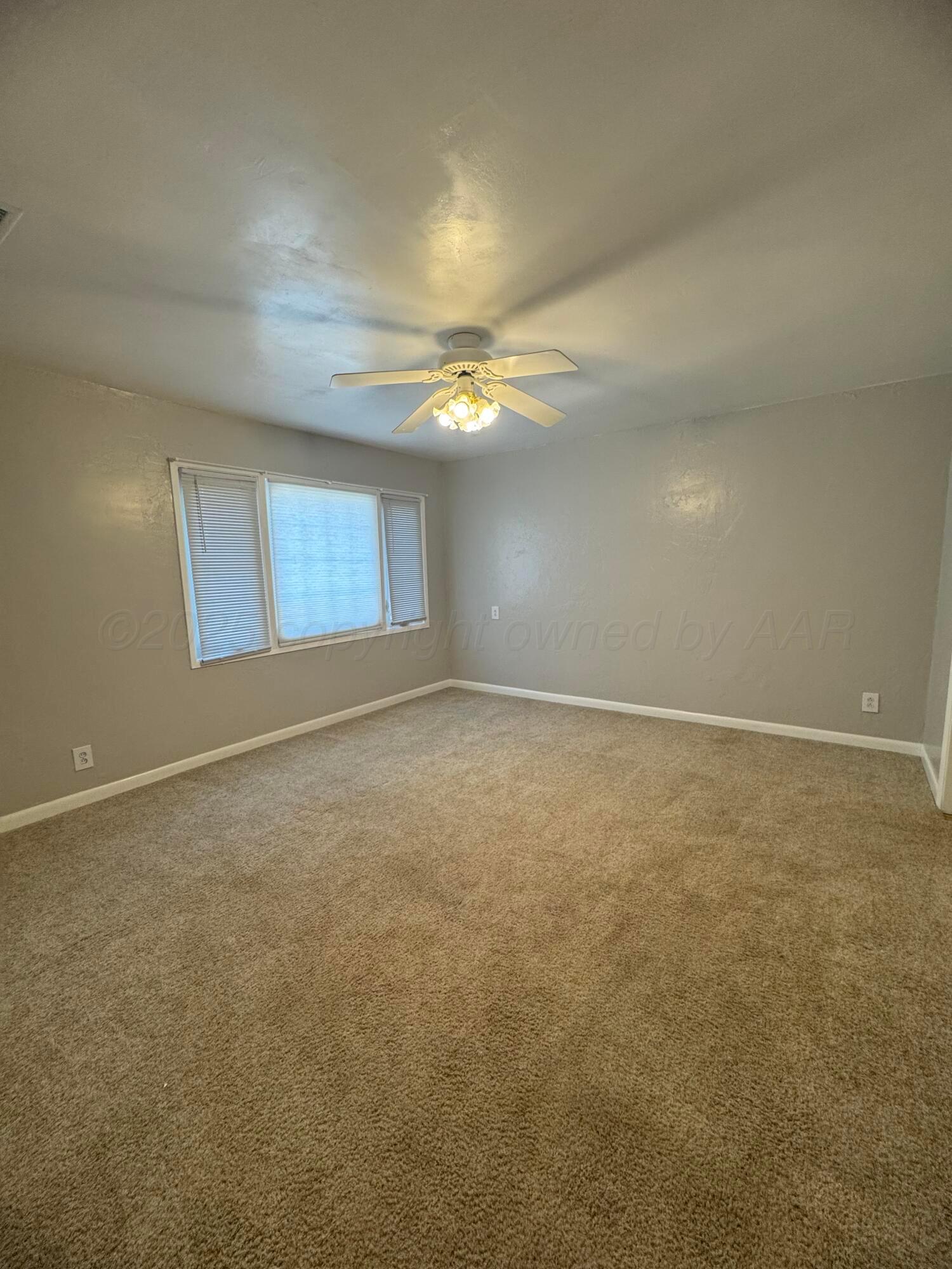 5112 Arden Road Amarillo, TX 79110 - Photo 23 of 28 an empty room with a empty space and windows