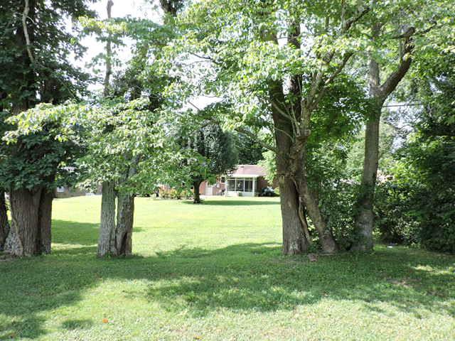 343 Kimbrough Road Clarksville, TN 37043 - Photo 29 of 30 Treelined with a buffer of beautiful trees for privacy. But as you can see easy access to drive your golf cart right on the course!