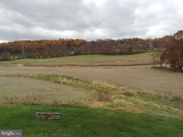 a view of a lake with houses in the back