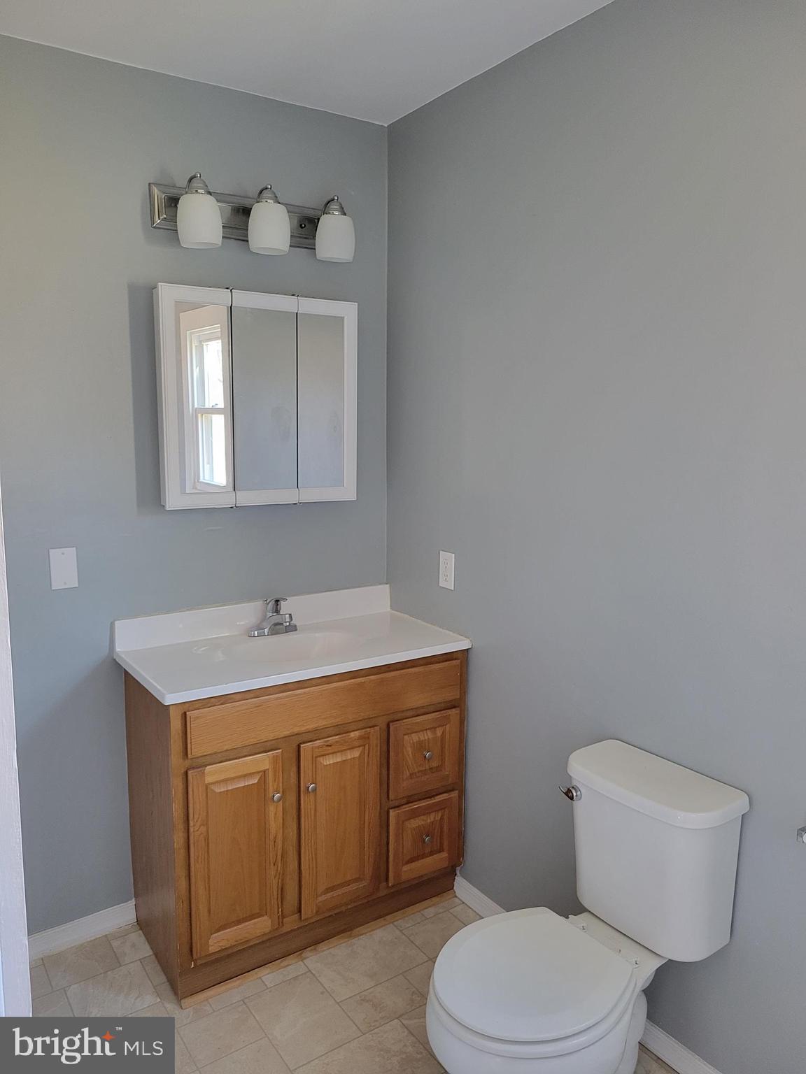 62 Kriebel Road Barto, PA 19504 - Photo 10 of 19 a bathroom with a toilet a sink and mirror
