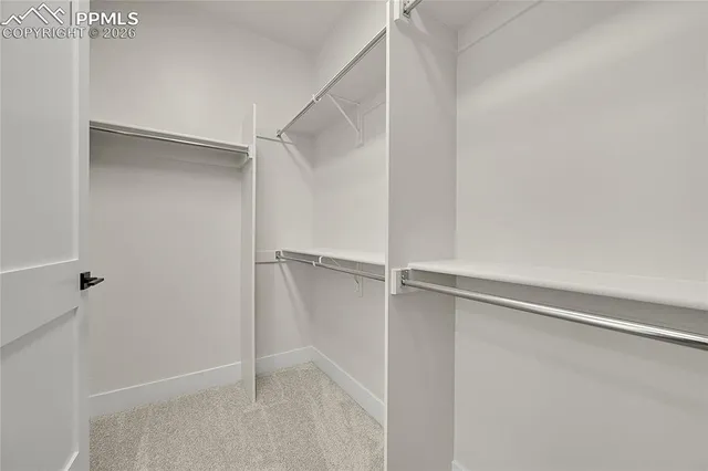 a view of an empty walk in closet