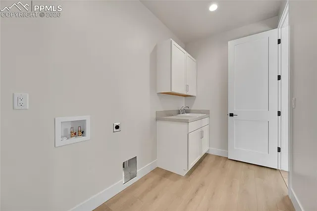 a view of a storage & utility room with wooden floor