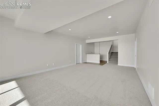 a view of work space with white walls