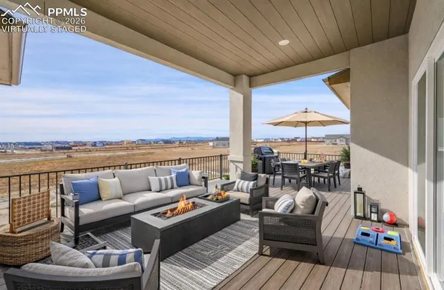 a balcony with furniture and outdoor view