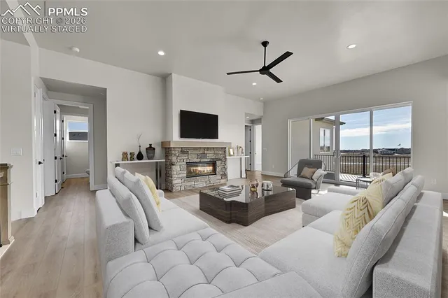 a living room with furniture fireplace and flat screen tv