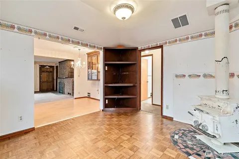 a view of a bedroom with a furniture and closet