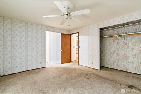 a view of an empty room with a window