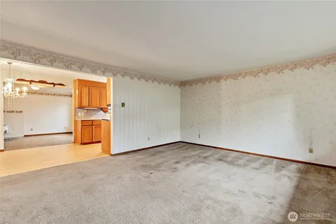 an empty room with a empty space and windows