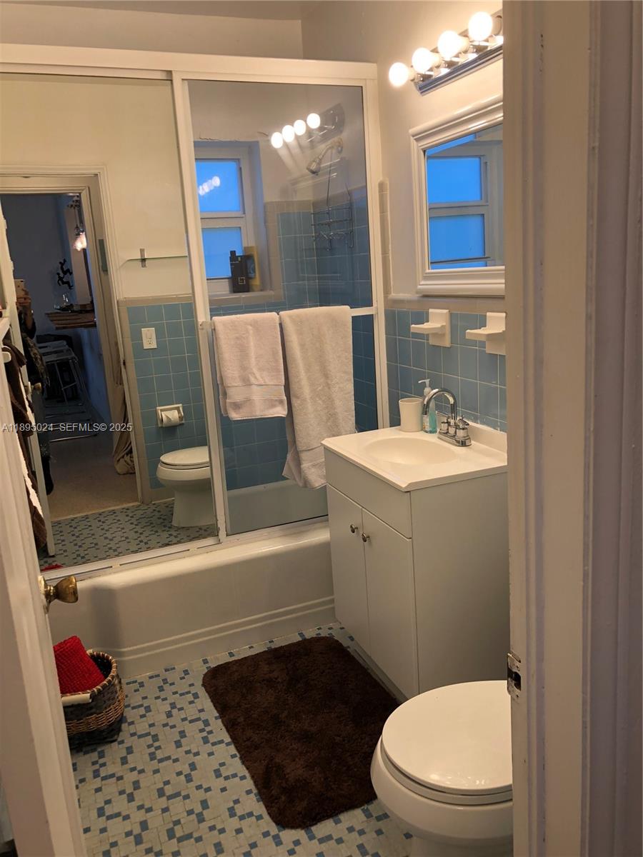 1160 Southwest 22nd Terrace, Unit 2 Miami, FL 33129 - Photo 13 of 29 a bathroom with a sink a toilet and shower