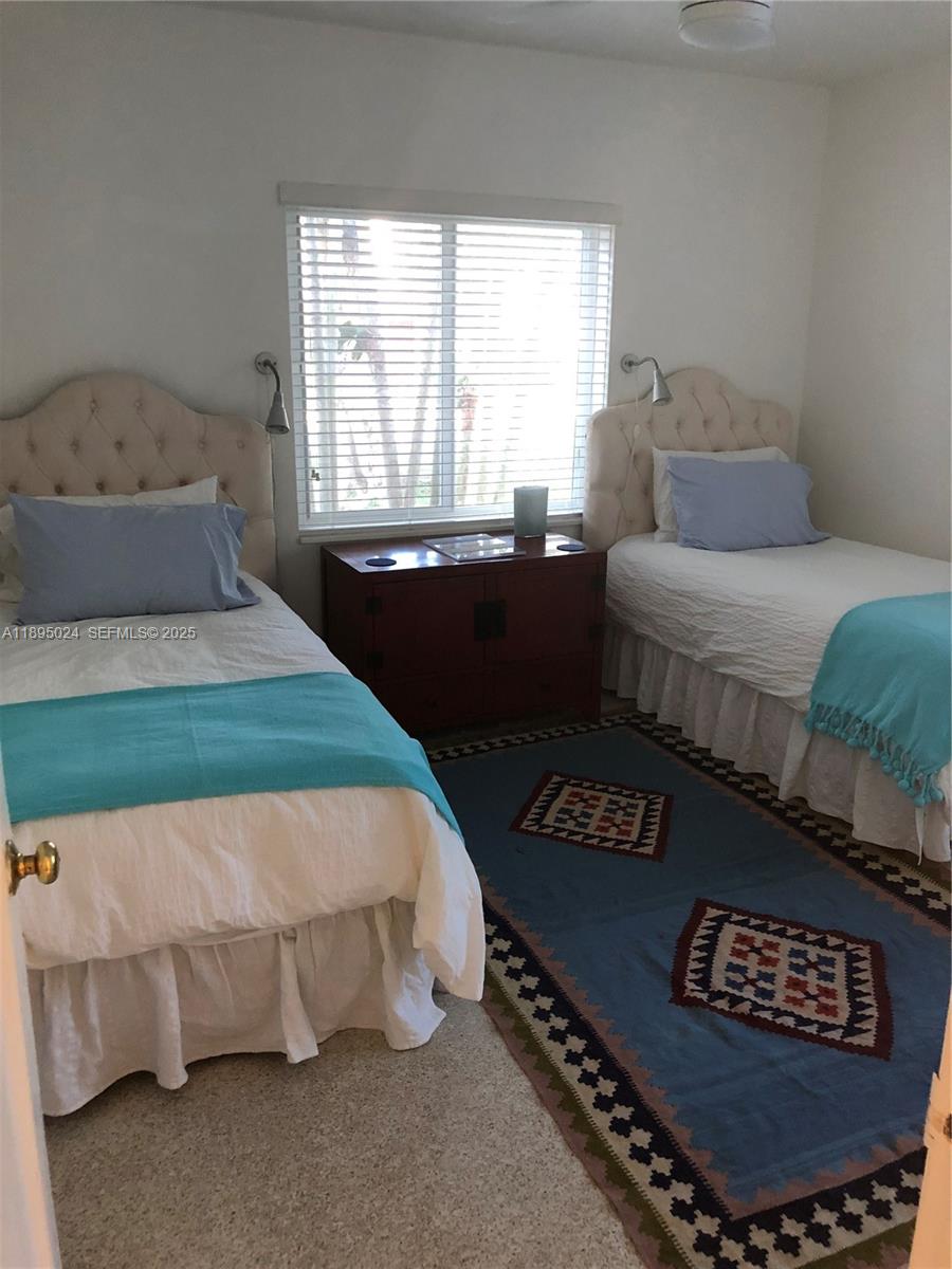 1160 Southwest 22nd Terrace, Unit 2 Miami, FL 33129 - Photo 15 of 29 a bedroom with a bed and a window