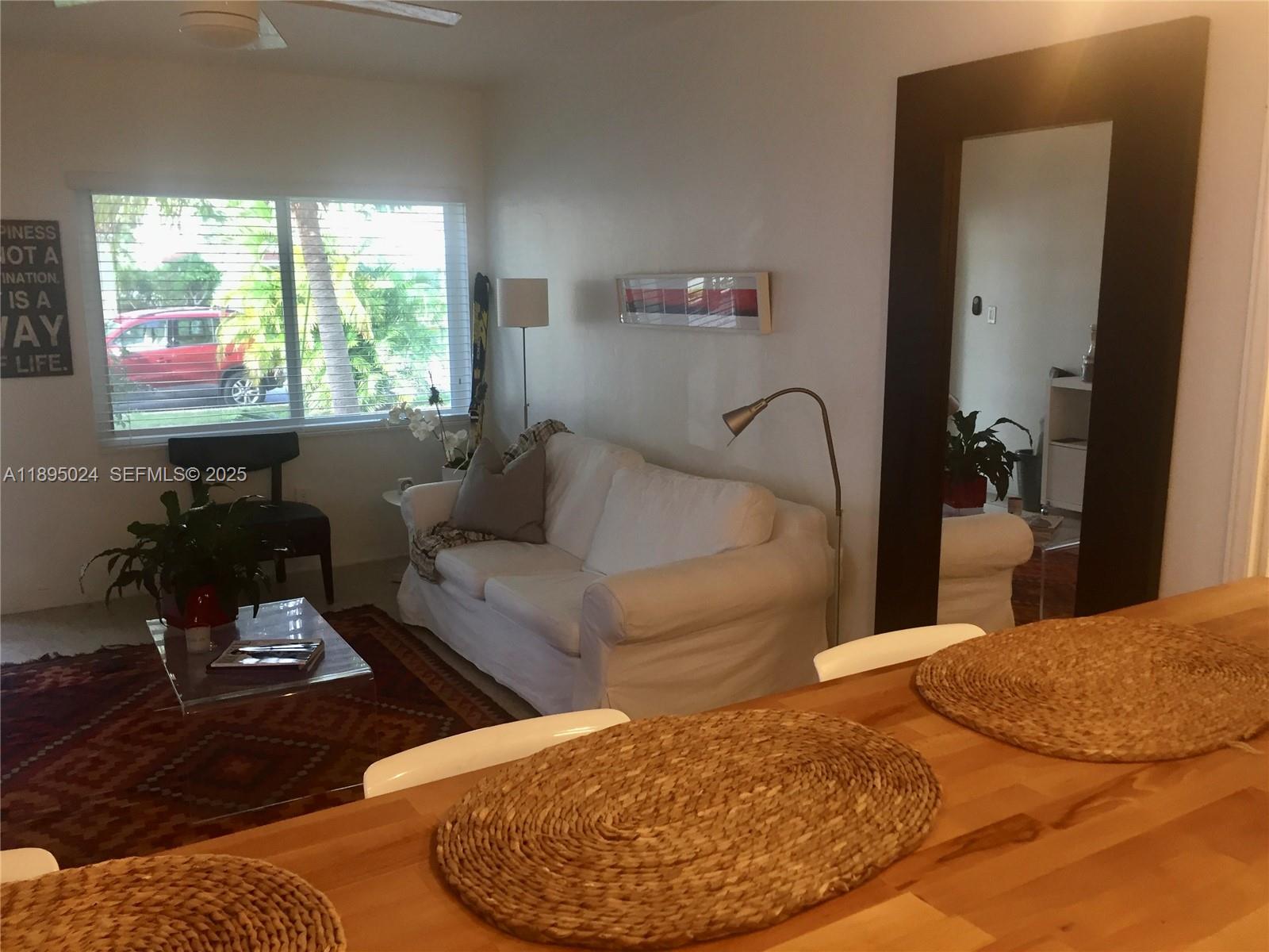 1160 Southwest 22nd Terrace, Unit 2 Miami, FL 33129 - Photo 17 of 29 a living room with furniture and a large window