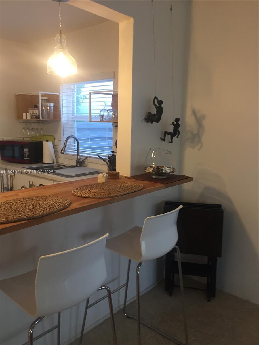 1160 Southwest 22nd Terrace, Unit 2 Miami, FL 33129 - Photo 19 of 29 a bathroom with a sink and a mirror