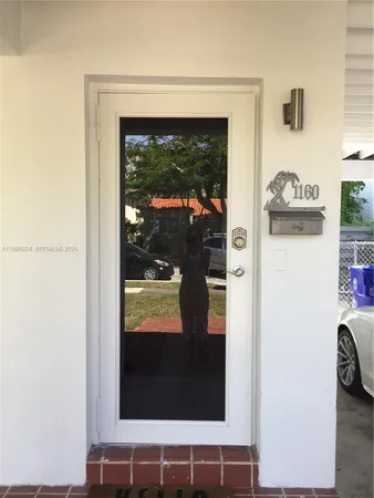 a view of a door and a window