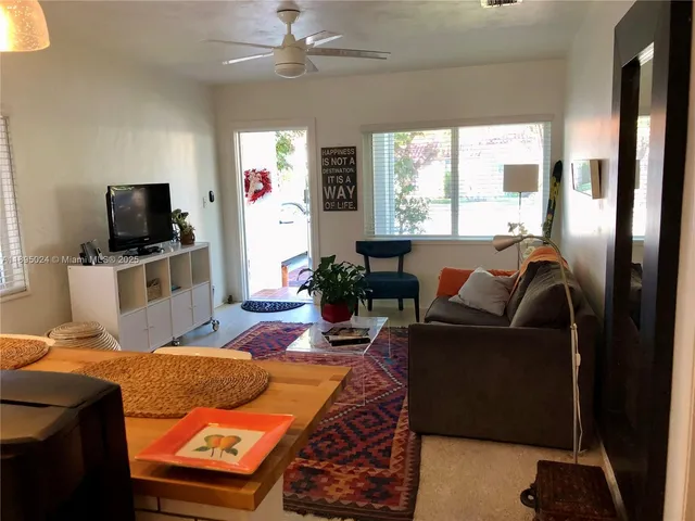 a bedroom with a bed and a television