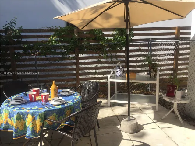 a table tennis table and chairs in patio