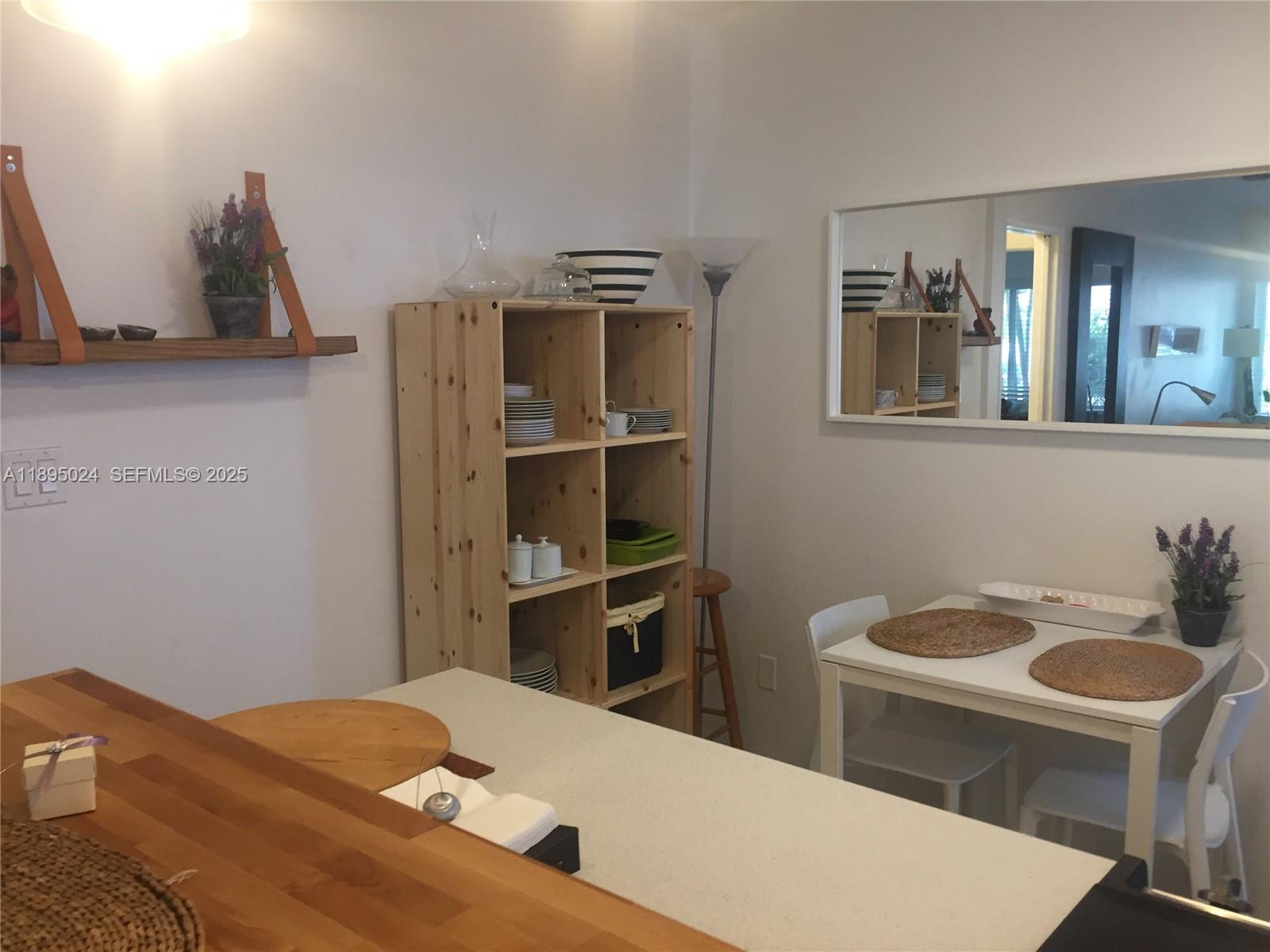 1160 Southwest 22nd Terrace, Unit 2 Miami, FL 33129 - Photo 6 of 29 a bedroom with a bed and furniture