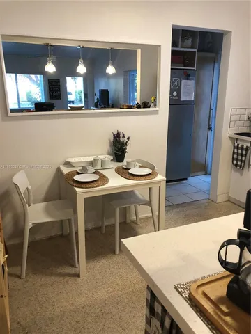 a table with chairs and a stove