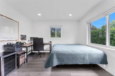 a bed room with a bed and a desk