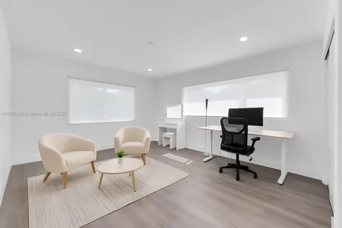 a workspace with furniture and a window