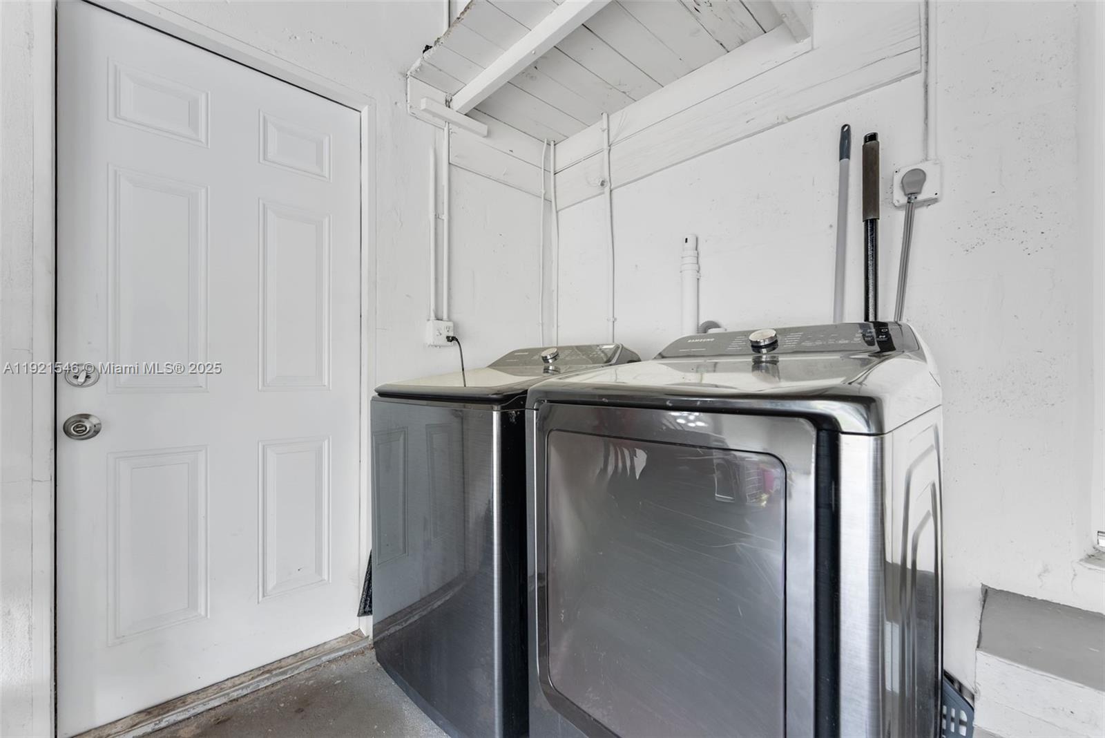 195 Northwest 115th Street Miami, FL 33168 - Photo 20 of 29 a utility room with stainless steel appliances granite countertop a sink and a refrigerator