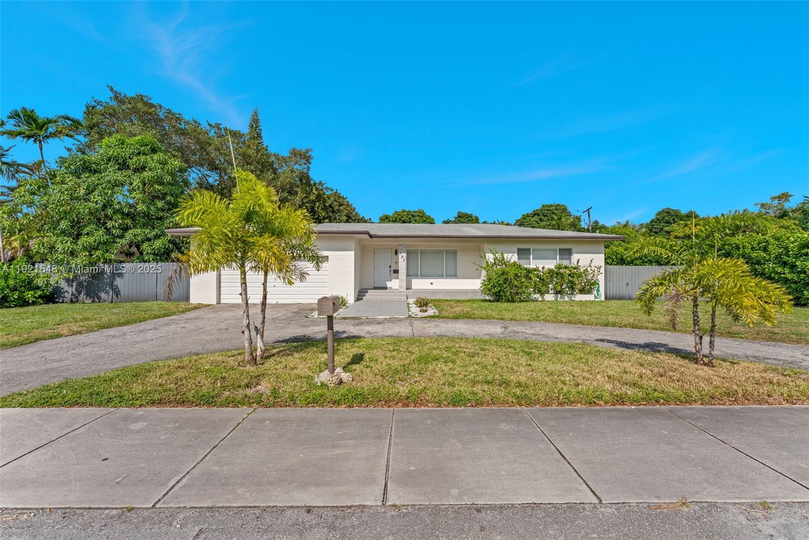 195 Northwest 115th Street Miami, FL 33168 - Photo 28 of 29 a front view of a house with a garden