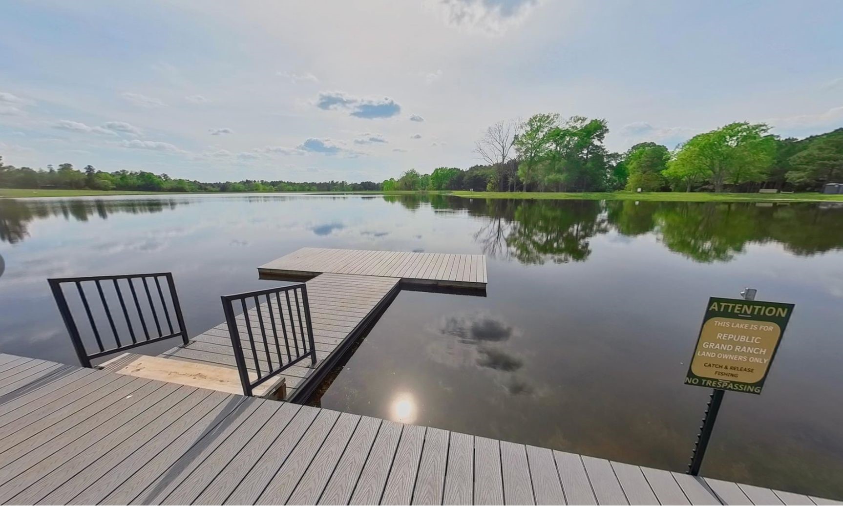 15890 Ridge Oak Road Willis, TX 77378 - Photo 6 of 11 a view of a lake with couches chairs and wooden floor