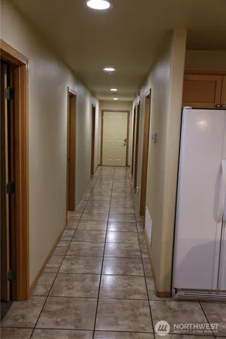 a view of gallery with wooden floor