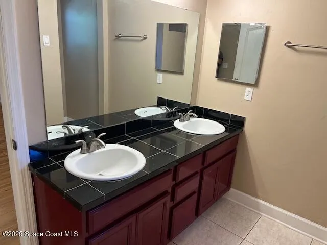a bathroom with sink and mirror